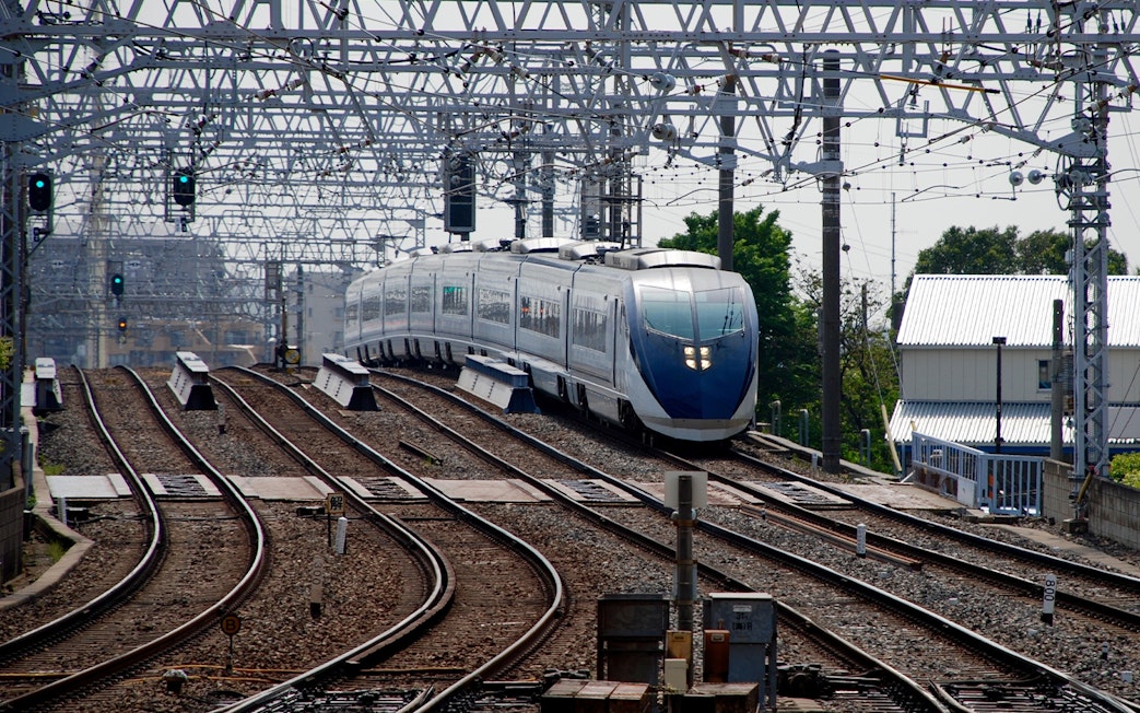 Tokyo Skyliner Airport Express departing station on railway tracks.