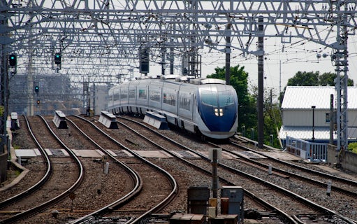Tokyo Skyliner Airport Express departing station on railway tracks.