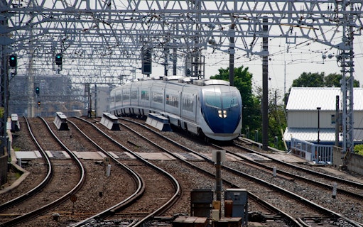 Tokyo Skyliner Airport Express departing station on railway tracks.