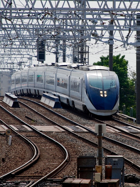 Tokyo Skyliner Airport Express departing station on railway tracks.