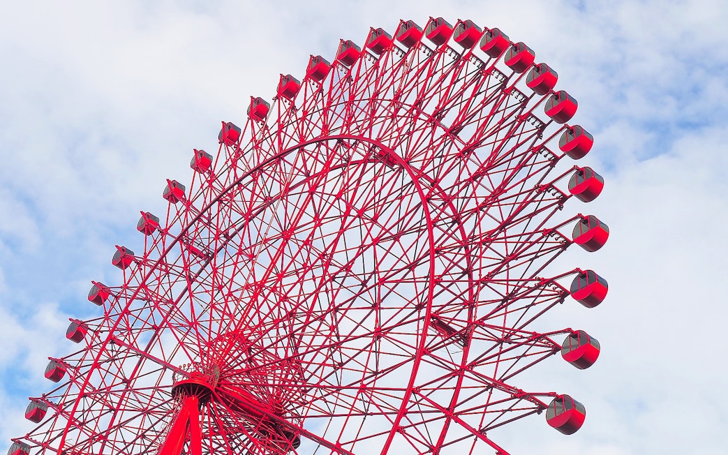 Red Ferris wheel against a blue sky, HEP Ferris Wheel Ticket.