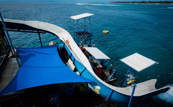 Water slide into ocean on Nusa Lembongan Island cruise.