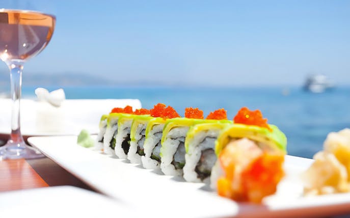 Sushi platter on a boat with sea view, Riveria Romagnola tour.