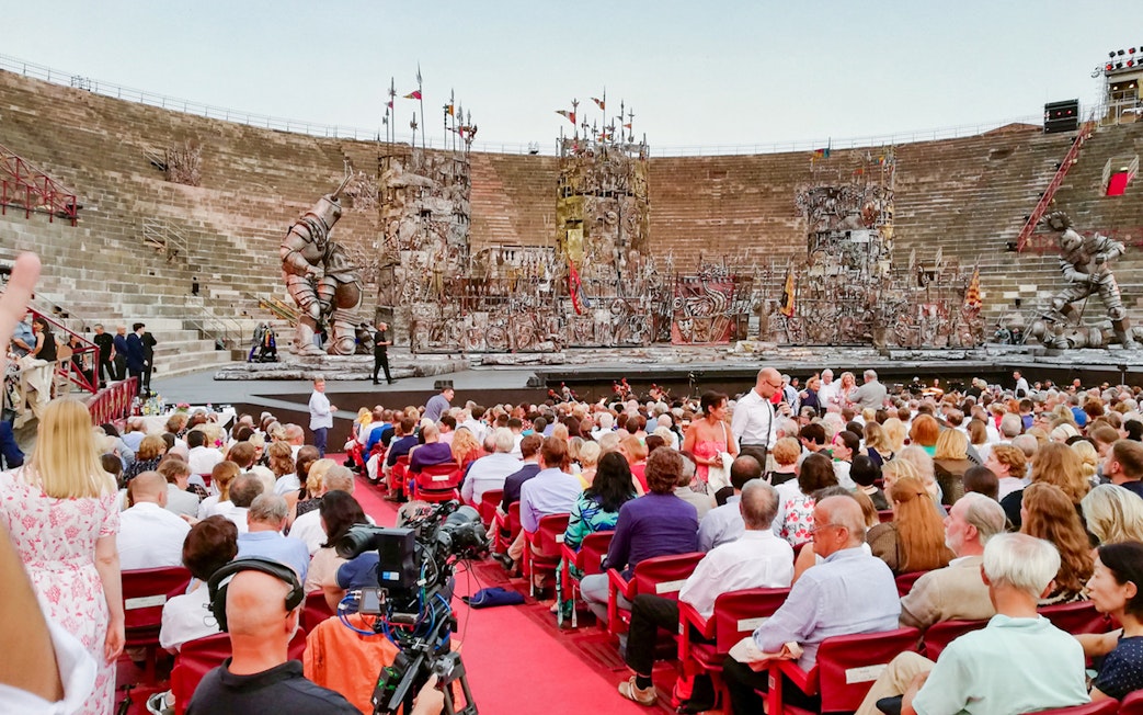 Crowd seated at Verona Arena for a live performance, Italy.