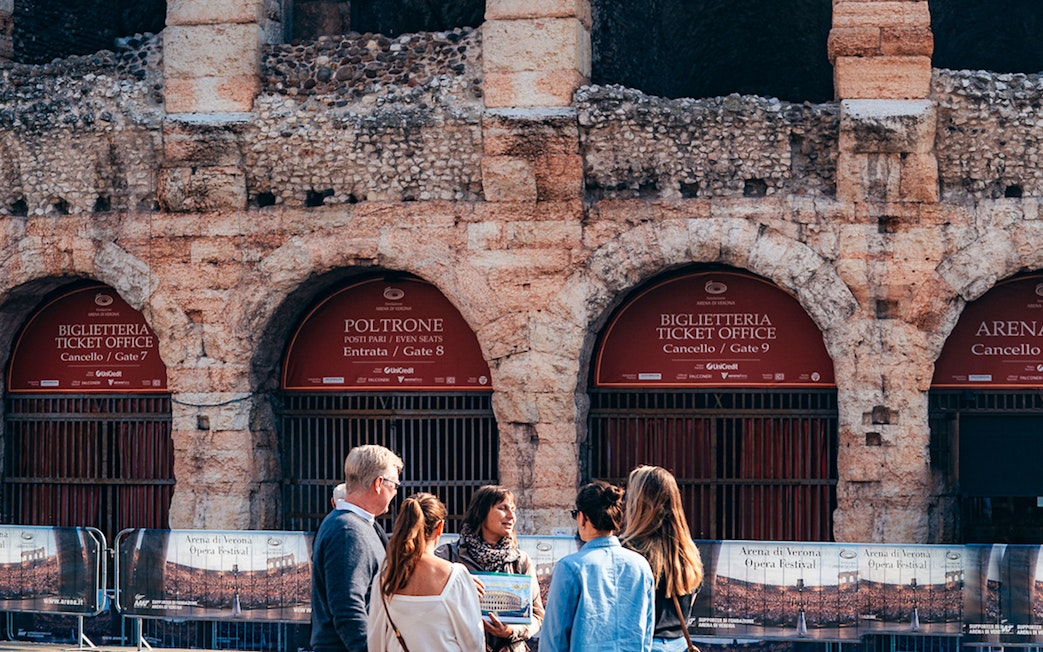 Visitors at Verona Arena ticket office, Italy, part of Combo: Gardaland Park + Verona City Card tour.