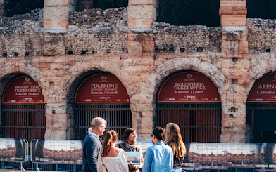 Visitors at Verona Arena ticket office, Italy, part of Combo: Gardaland Park + Verona City Card tour.