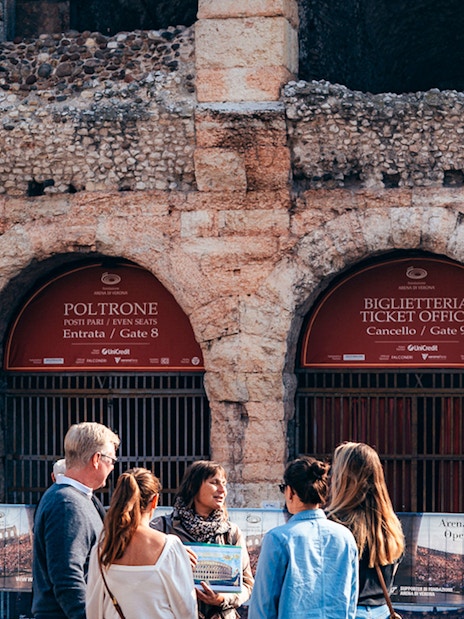 Visitors at Verona Arena ticket office, Italy, part of Combo: Gardaland Park + Verona City Card tour.
