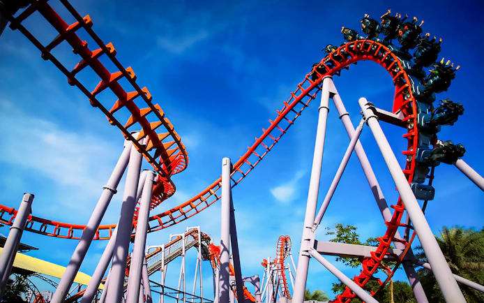 Roller coaster at Siam Amazing Park, Bangkok, with blue sky backdrop.