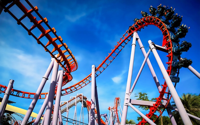 Roller coaster at Siam Amazing Park, Bangkok, with blue sky backdrop.