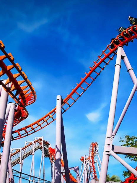 Roller coaster at Siam Amazing Park, Bangkok, with blue sky backdrop.