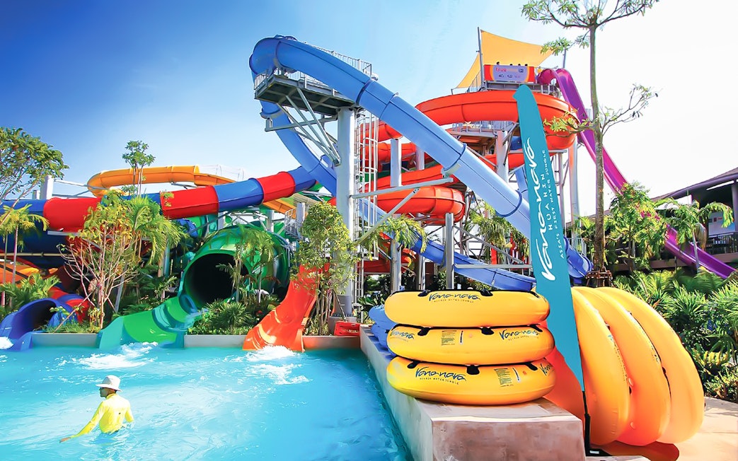 Colorful water slides and pool at Vana Nava Water Jungle, Hua Hin, Thailand.
