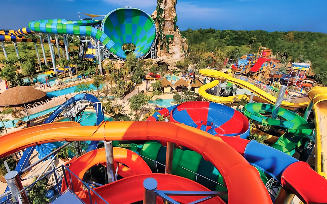 Colorful water slides at Vana Nava Water Jungle, Hua Hin, Thailand.