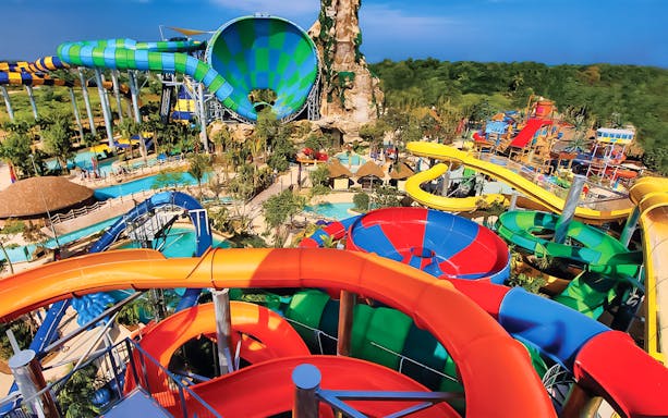 Colorful water slides at Vana Nava Water Jungle, Hua Hin, Thailand.