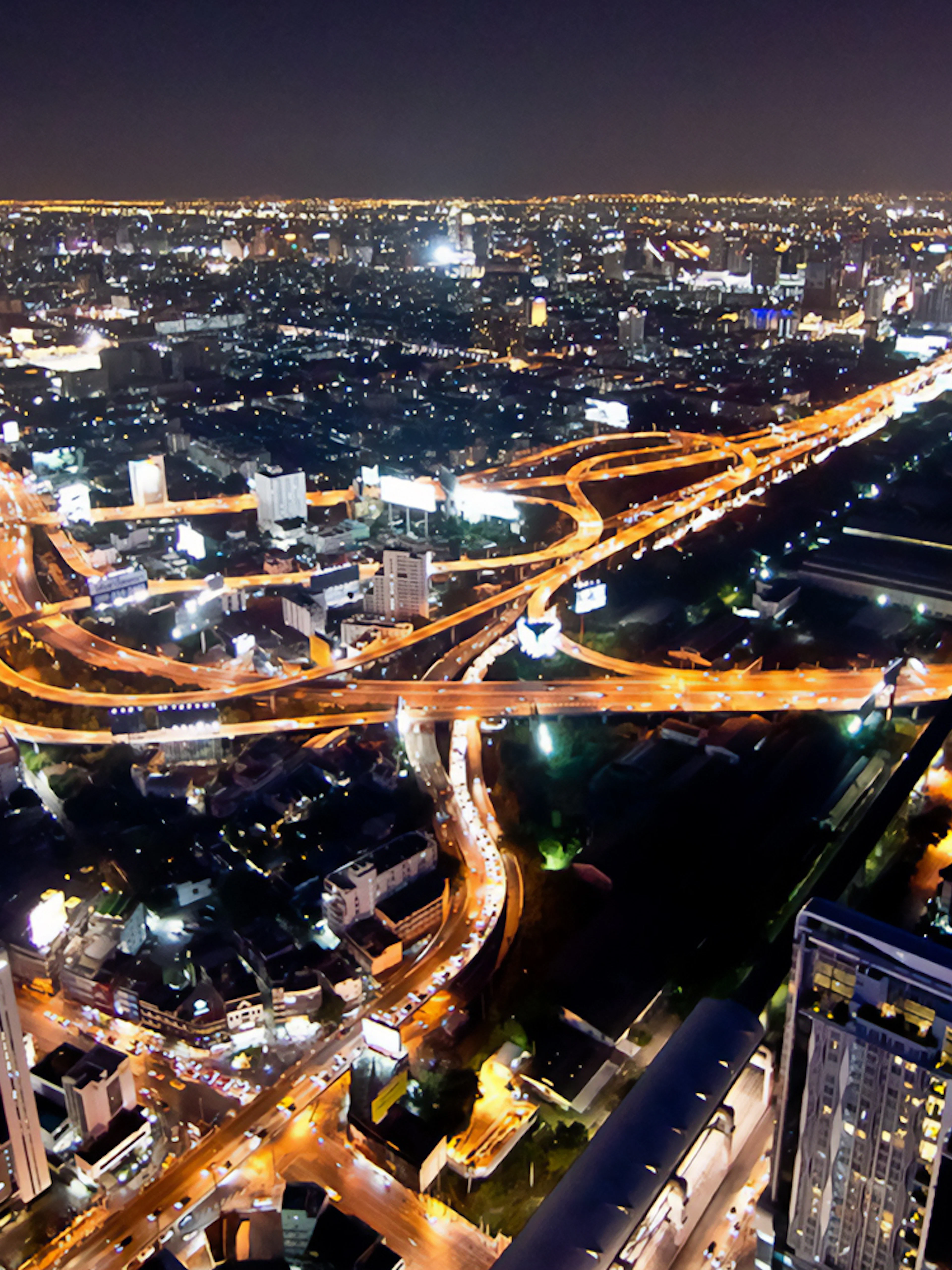Bangkok cityscape view from Baiyoke Sky Hotel Observation Deck at night.