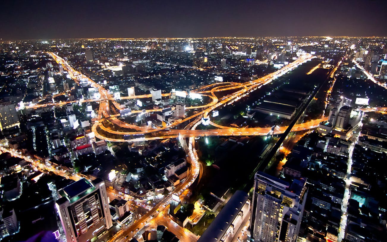 Bangkok cityscape view from Baiyoke Sky Hotel Observation Deck at night.