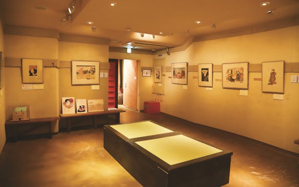 Kamigata Ukiyoe Museum interior with framed artworks on display in Osaka, Japan.