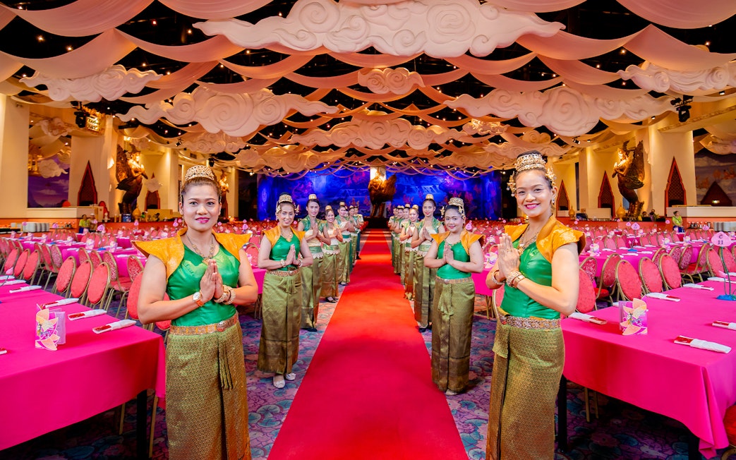 Staff welcoming guests at The Golden Kinnaree Buffet Restaurant, Phuket Fantasea.