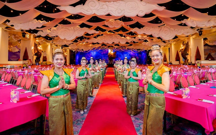 Staff welcoming guests at The Golden Kinnaree Buffet Restaurant, Phuket Fantasea.