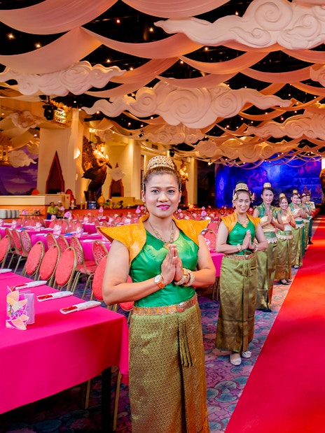 Staff welcoming guests at The Golden Kinnaree Buffet Restaurant, Phuket Fantasea.