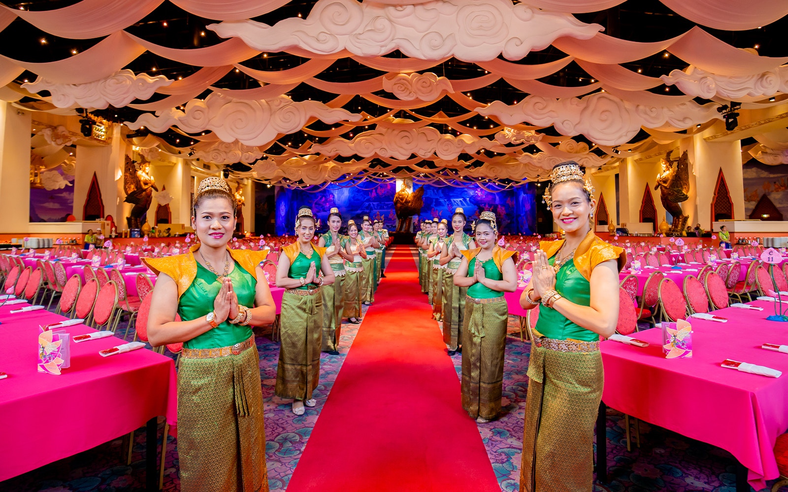 Staff welcoming guests at The Golden Kinnaree Buffet Restaurant, Phuket Fantasea.