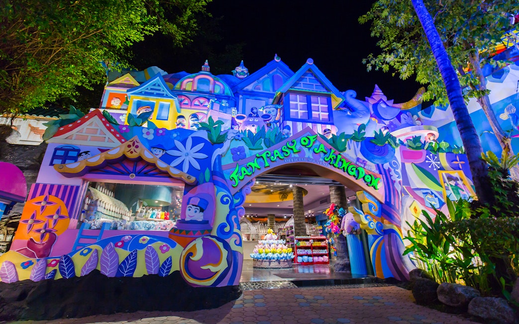 Colorful entrance to Phuket Fantasea theme park in Thailand at night.