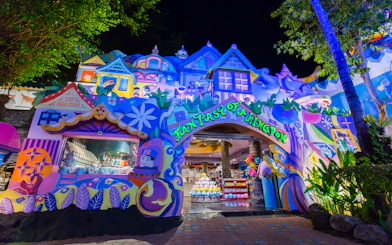 Colorful entrance to Phuket Fantasea theme park in Thailand at night.