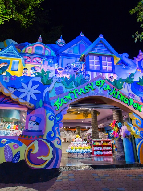 Colorful entrance to Phuket Fantasea theme park in Thailand at night.