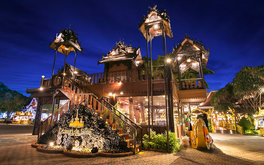 Phuket Fantasea entrance with traditional Thai architecture at night.