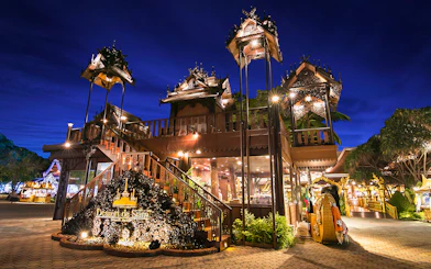 Phuket Fantasea entrance with traditional Thai architecture at night.