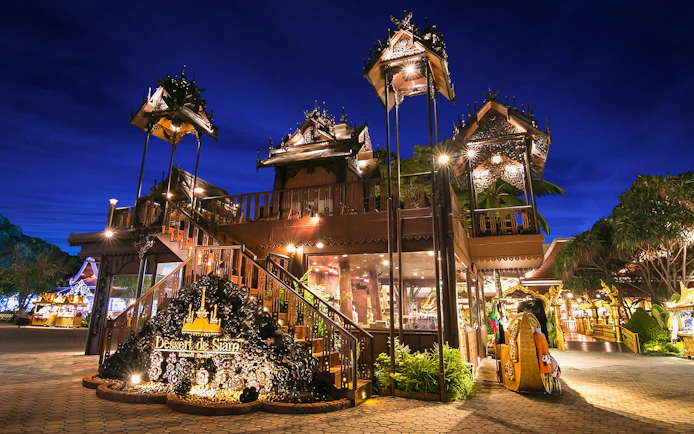 Phuket Fantasea entrance with traditional Thai architecture at night.