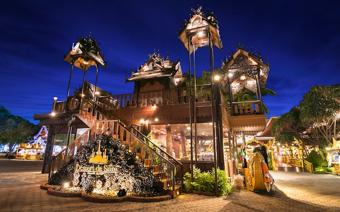 Phuket Fantasea entrance with traditional Thai architecture at night.