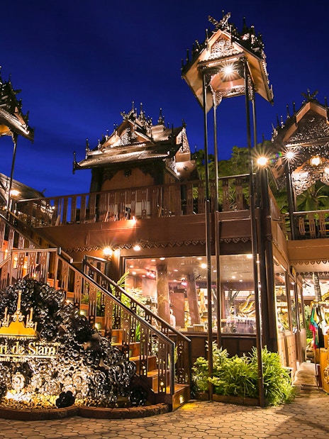 Phuket Fantasea entrance with traditional Thai architecture at night.