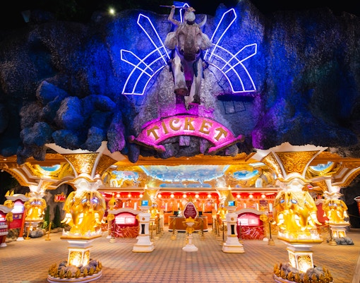 Phuket Fantasea cultural show with performers in traditional costumes on stage.