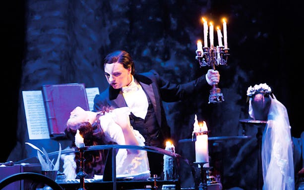 Phantom of the Opera scene with masked character holding candelabra at Arts Centre Melbourne.