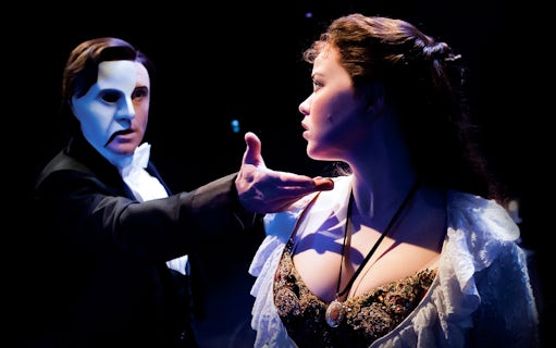 Phantom of the Opera scene at Arts Centre Melbourne with masked character and woman in costume.