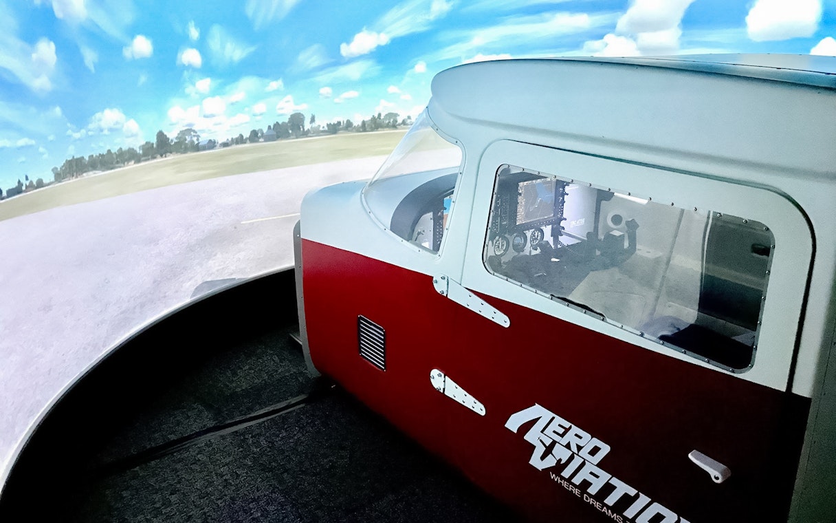 Flight simulator cockpit at Aeroviation for a 100-minute full flight experience.