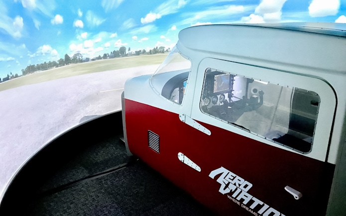Flight simulator cockpit at Aeroviation for a 100-minute full flight experience.