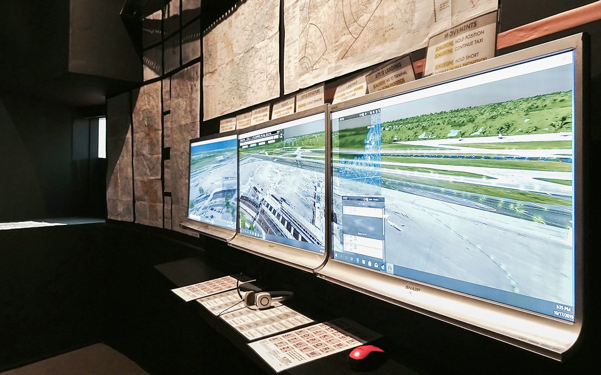 Flight simulator screens displaying airport runway for Aeroviation Full Flight Experience.