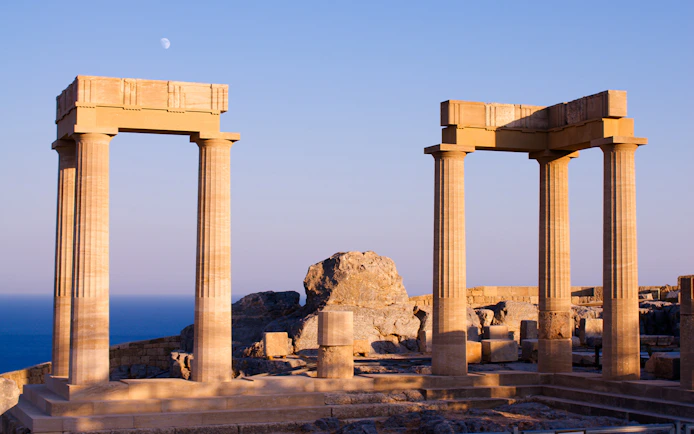 Ancient columns at Acropolis of Lindos with sea view, Rhodes, Greece.