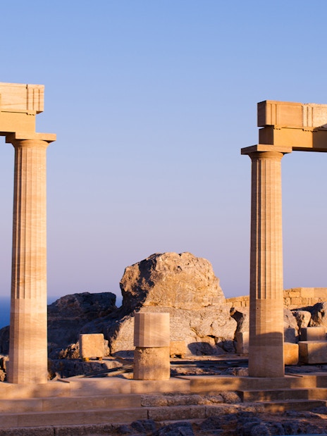 Ancient columns at Acropolis of Lindos with sea view, Rhodes, Greece.