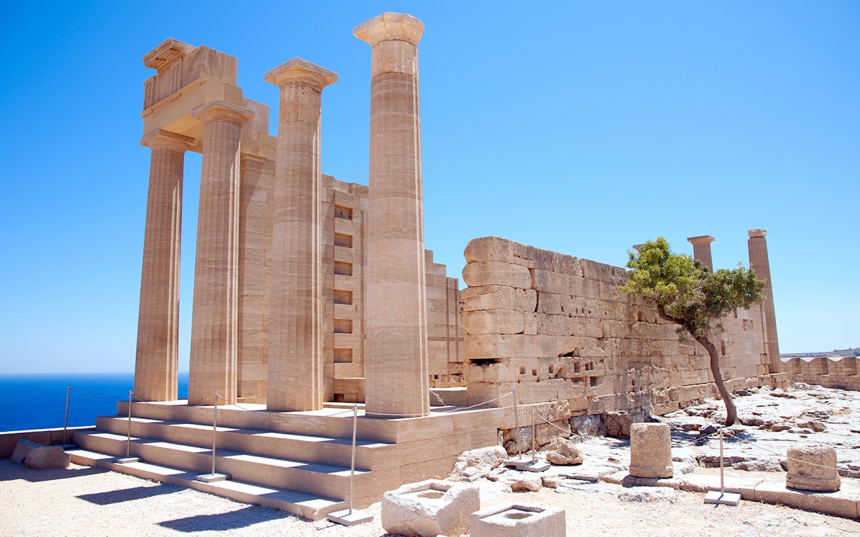 Ancient columns and ruins at the Acropolis of Lindos, Rhodes, Greece.