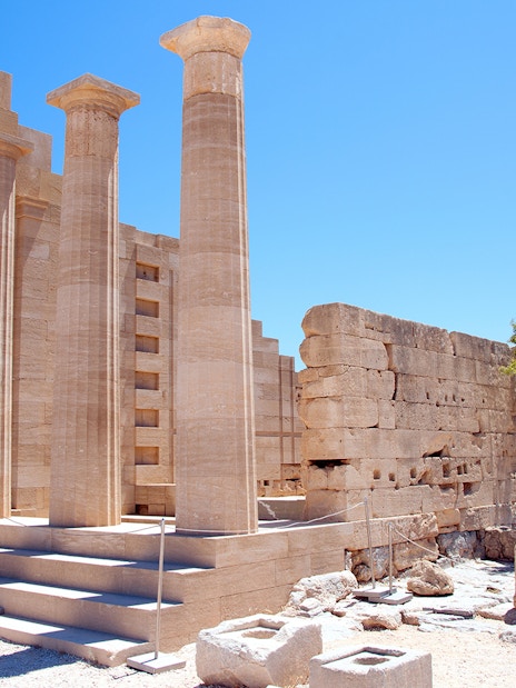 Ancient columns and ruins at the Acropolis of Lindos, Rhodes, Greece.