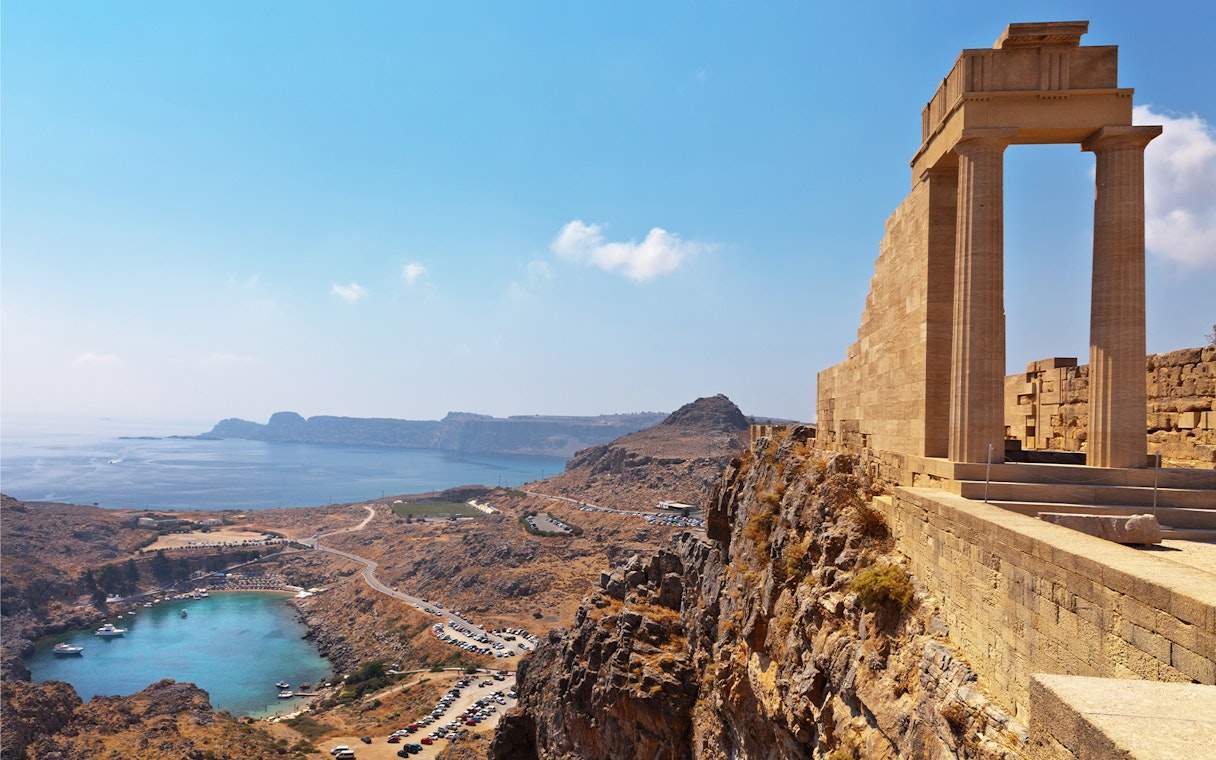 Acropolis of Lindos overlooking the sea with ancient ruins and coastal landscape.