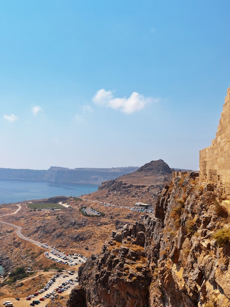 Acropolis of Lindos overlooking the sea with ancient ruins and coastal landscape.