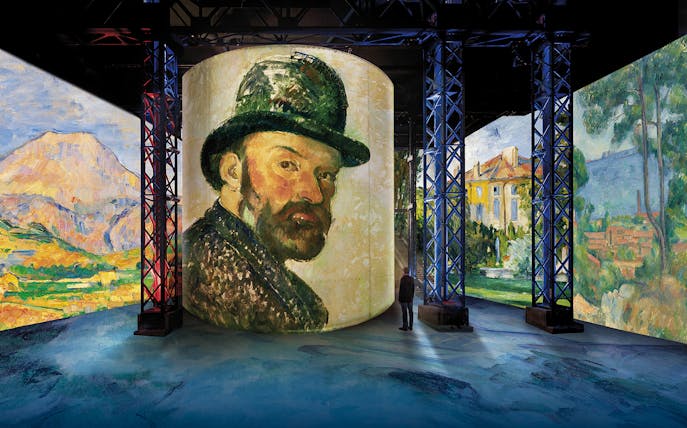 Immersive art display at L'Atelier des Lumières featuring Cézanne's works, Paris.