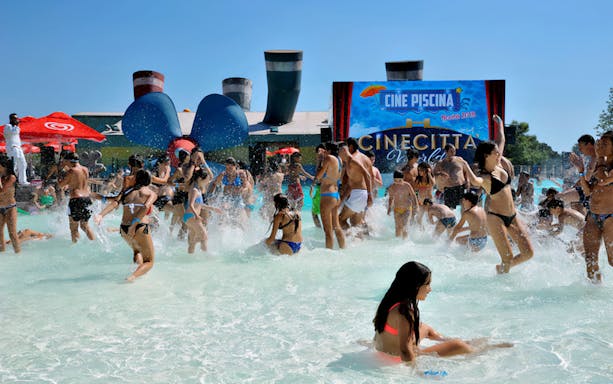 Visitors enjoying the water park at Cinecittà World, Italy.