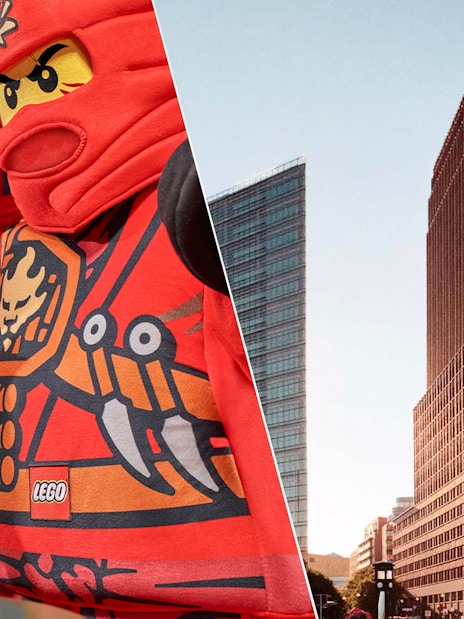 Child high-fiving LEGO character at LEGOLAND Discovery Centre Berlin; Panoramapunkt Berlin skyscraper.