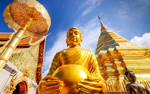 Golden Buddha statue and stupa at Wat Phra That Doi Suthep, Chiang Mai, Thailand.