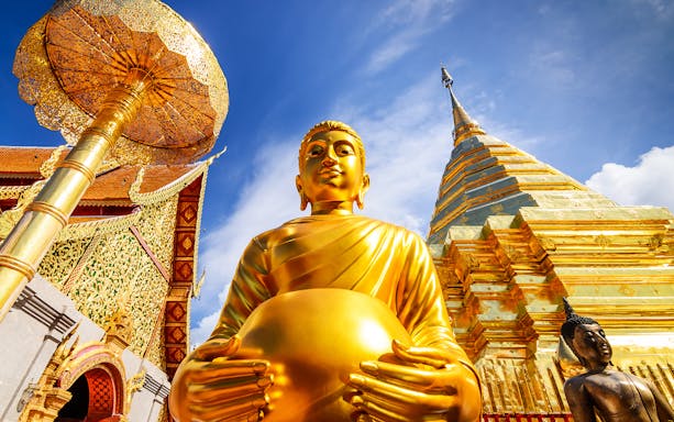 Golden Buddha statue and stupa at Wat Phra That Doi Suthep, Chiang Mai, Thailand.