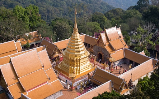 Golden stupa of Wat Phra That Doi Suthep surrounded by temple buildings in Chiang Mai, Thailand.